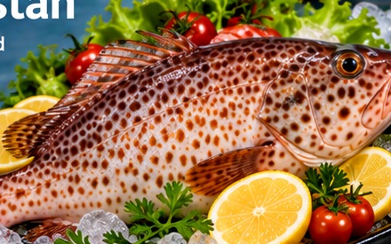 Reef cod beautifully presented on a serving plate with lemon, herbs and ice